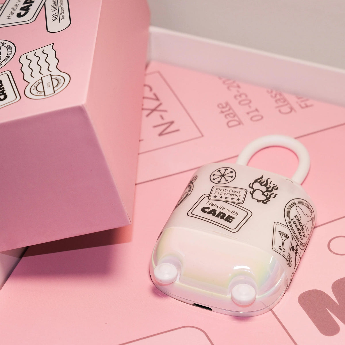 Pastel NOX Traveller date-night box and suitcase-style case, packed and ready for a weekend away.