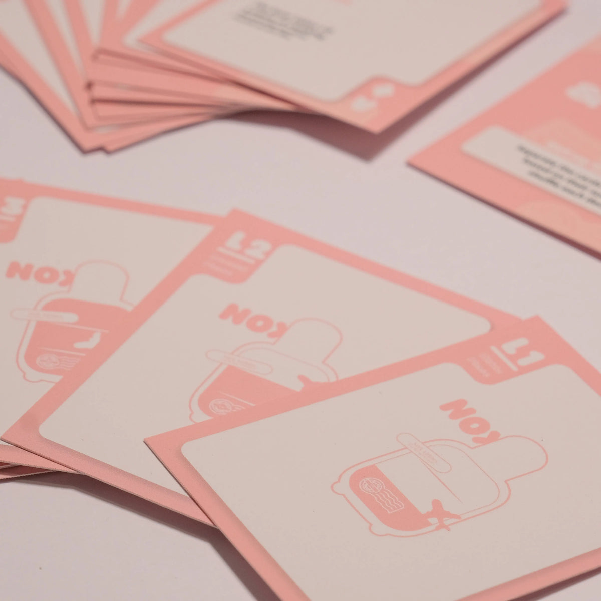 Close-up view of the pink NOX couples intimacy card game, part of the date night box set.
