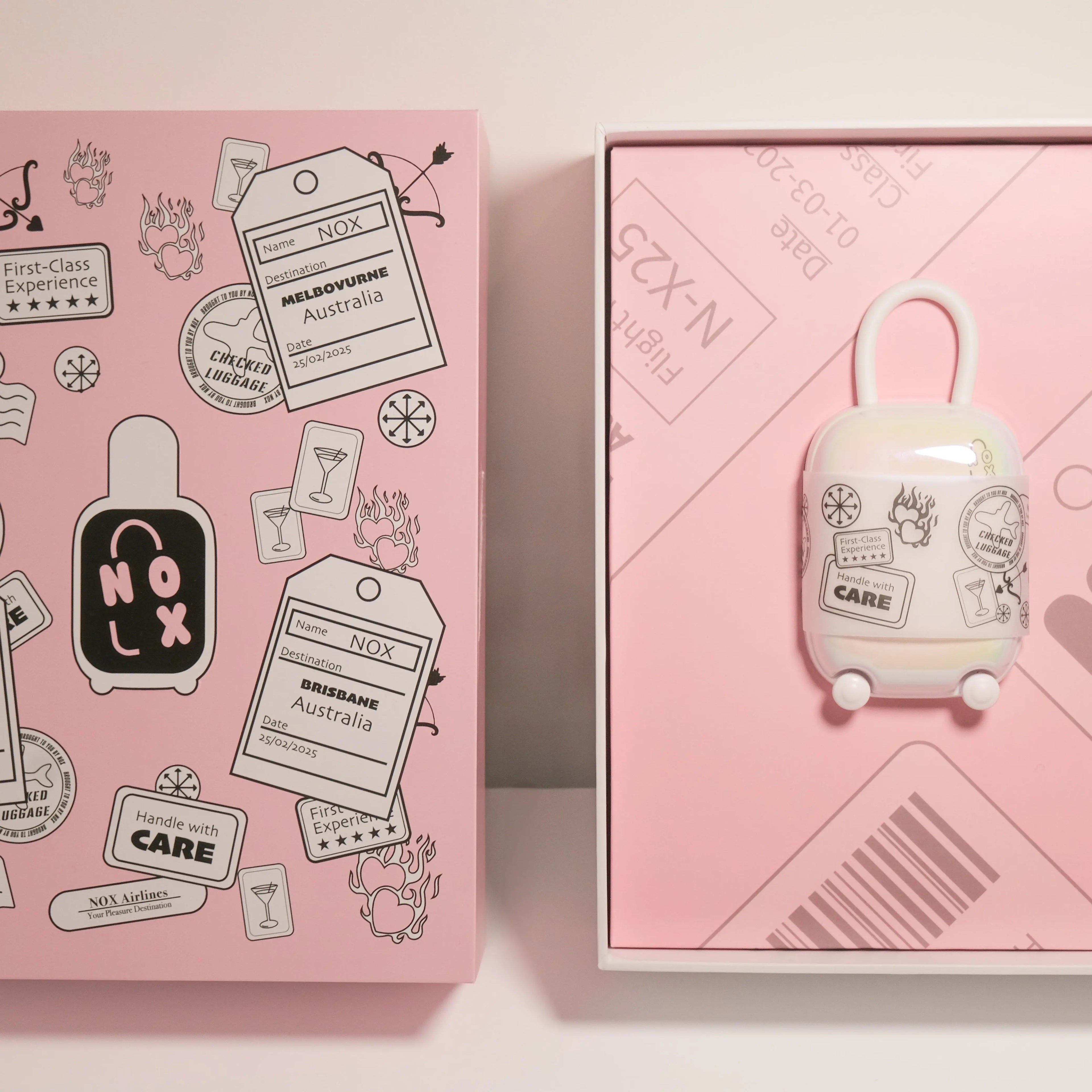 Cute white travel case for vibrator standing next to pink NOX gift box