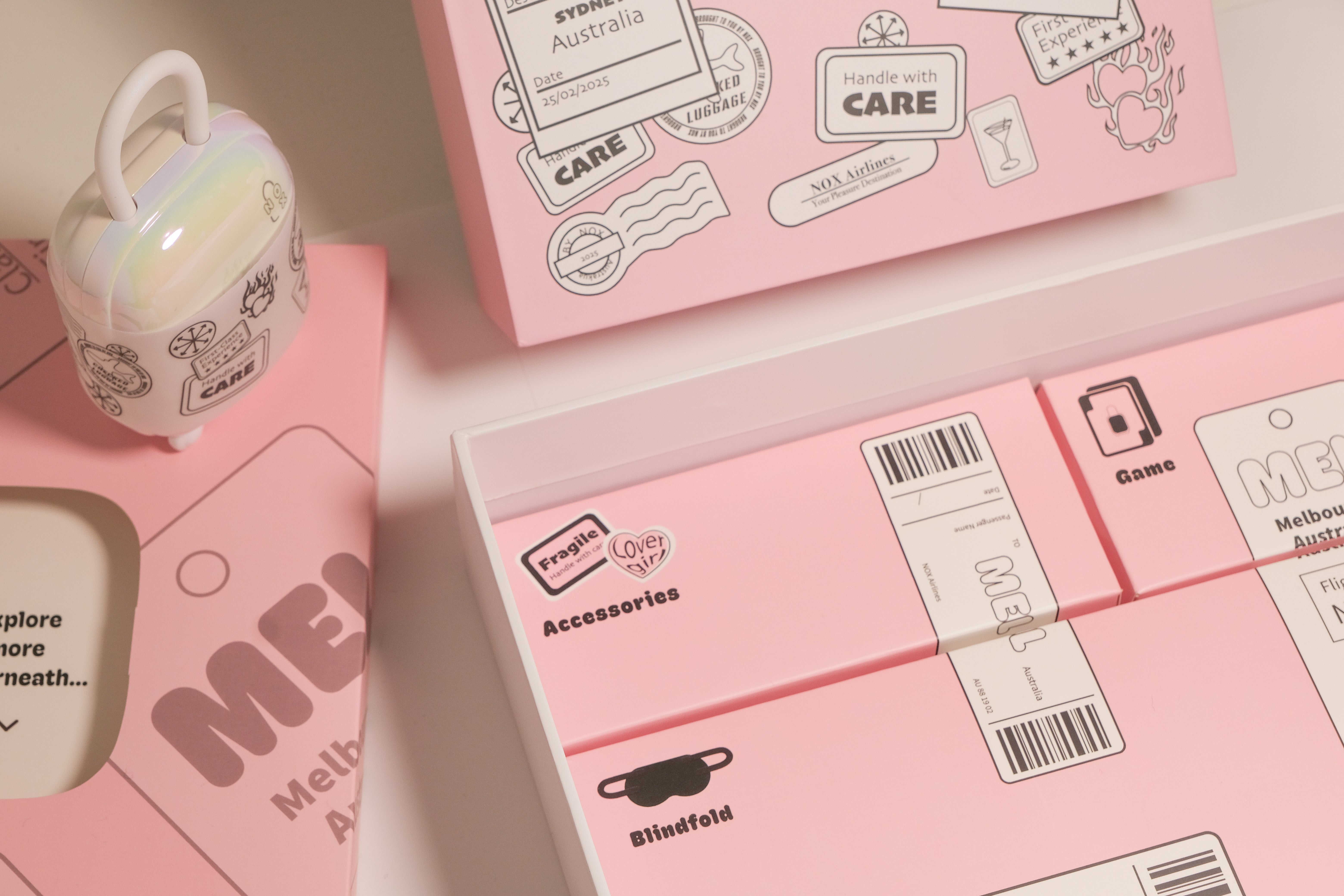 Full view of the aesthetic NOX Traveller date night box gift set packaging with accessories and suitcase charger.