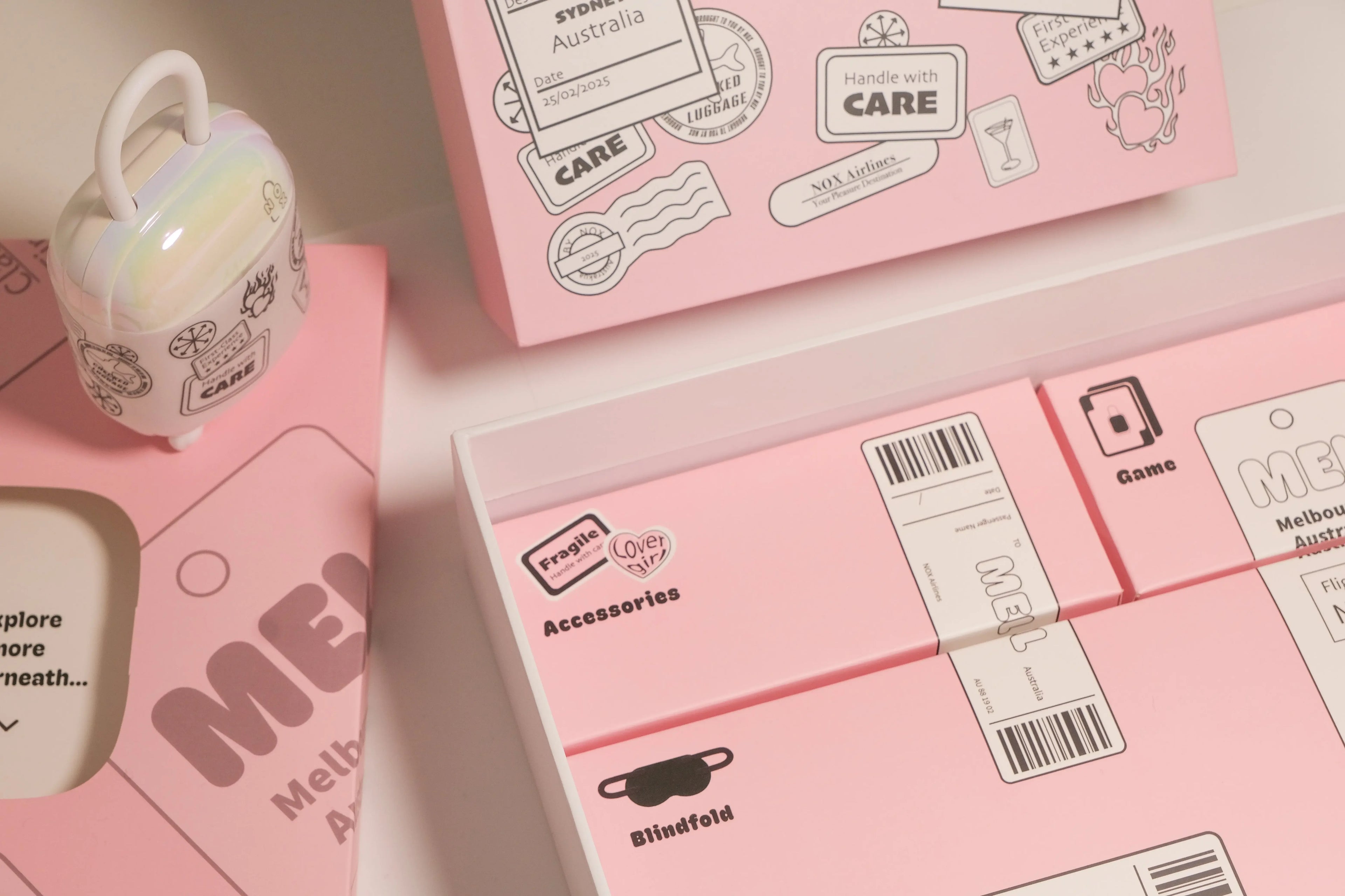 Full view of the aesthetic NOX Traveller date night box gift set packaging with accessories and suitcase charger.