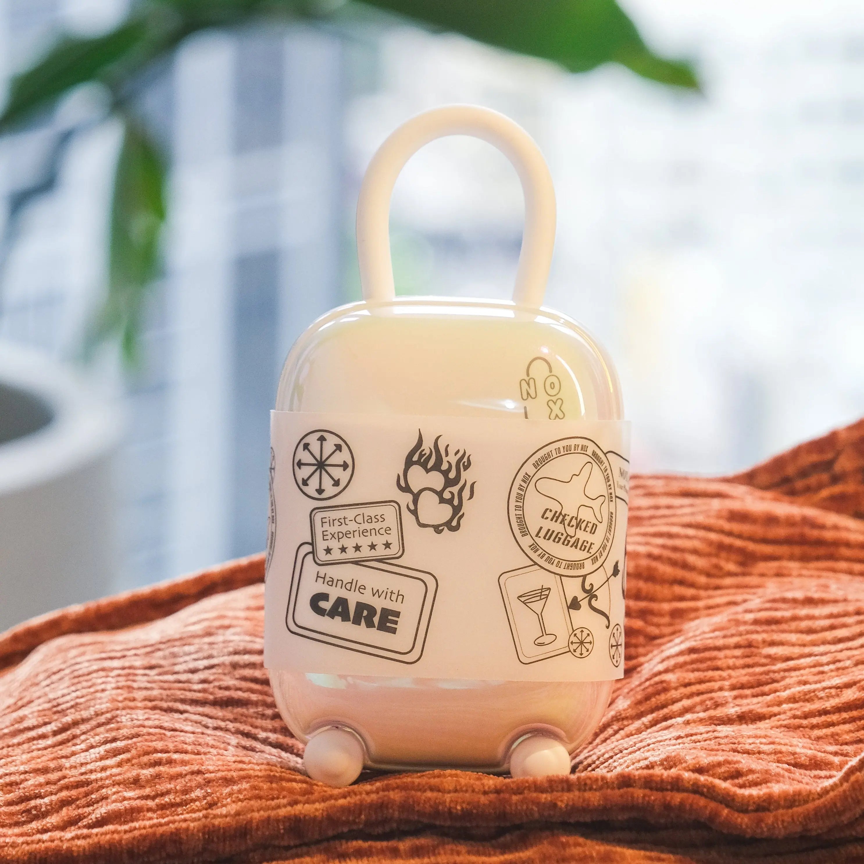 Romantic flatlay with pink satin blindfold, date night cards, and open NOX Traveller case