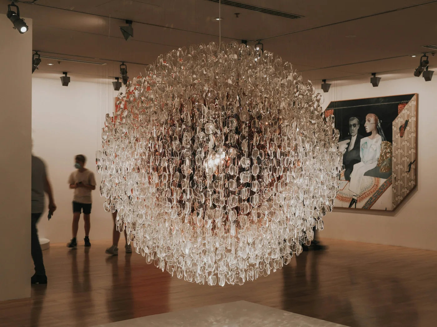 Visitors beside a suspended sculptural installation at the National Gallery of Victoria, Melbourne